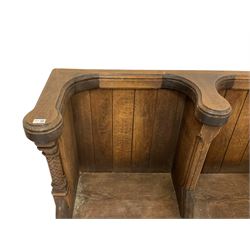 19th century oak four seat church pew or choir stall, shaped and moulded top rails over boarded back and moulded upright divisions, single plank seat, the ends with turned floral carved pilasters, one end with Gothic style tracery work

Provenance - St. Giles Cathedral, Edinburgh
