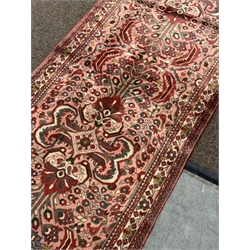 Persian red and pink ground runner rug, overall floral design with Herati motifs, guarded border decorated with stylised flower heads, 375cm x 85cm