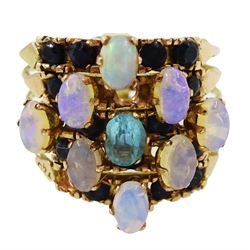 Gold opal, sapphire and blue stone five band ring