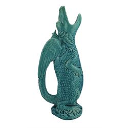 Burmantofts Faience turquoise-glaze Grotesque Dragon ewer, modelled as standing with a tilted head and gaping jaw, the wings forming the handle, impressed factory marks beneath, model no. 549, H39cm