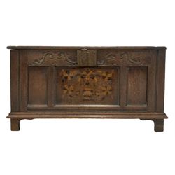 19th century oak coffer, the hinged lifting lid over blind carved frieze and panelled base, raised on bracket supports 