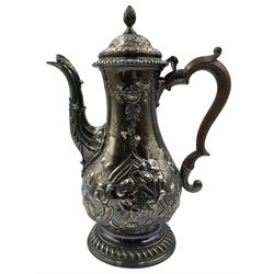 George III silver coffee pot with later embossed decoration of flowers and leaves, stained handle and gadrooned foot H28cm London 1770 Maker Charles Wright