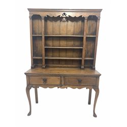 18th century country oak dresser, projecting cornice over shaped and pierced apron and three open shelves, two drawers to base, raised on cabriole supports W126cm, H186cm, D45cm