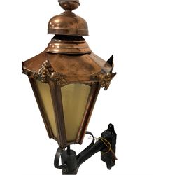 Pair Victorian style copper lanterns, fitted with wall mounts, tapering hexagonal form with decorative moulded mounts, finial toppped