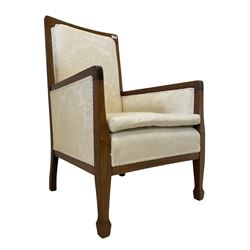 Edwardian mahogany framed armchair, satinwood stringing, upholstered in ivory foliate patterned damask fabric, on tapered supports with spade feet