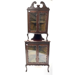 Georgian style walnut floor standing two tier corner cupboard, with acanthus carved swan neck pediment over two glazed doors enclosing shelf and velvet lined interior, repeated form under, raised on cabriole supports, W72cm, H194cm, D50cm