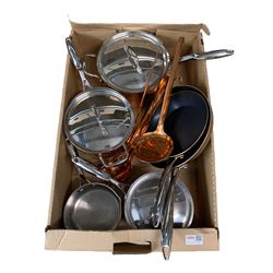 Three Stellar copper saucepans with lids, two copper frying pans and copper kitchen utensils with wall rack
