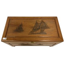 Singapore carved camphor wood blanket chest, rectangular top enclosing removable tray, decorated with carvings of traditional pagoda and ship scenes