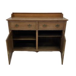 Late 19th century oak sideboard, the raised back over two drawers and two cupboards, opening to reveal two fixed shelves, raised on turned bun feet 