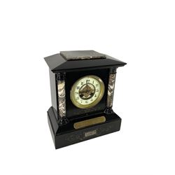 French - late 19th century Belgium slate and marble 8-day mantle clock, with flat top and sloping corners, recessed circular columns to the front in contrasting polished marble and incised gilt decoration, brass presentation plaque dated 1882  enamel two part dial with Arabic numerals,  steel spade hands and applied gilt decoration to the centre, rack striking movement striking on a gong.
With pendulum.