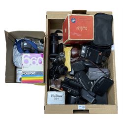 Vintage cameras and accessories in two boxes