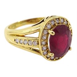 18ct gold oval cut ruby and round brilliant cut diamond cluster ring, with diamond set shoulders, Sheffield 2012, ruby approx 3.55 carat, total diamond weight approx 0.30 carat
