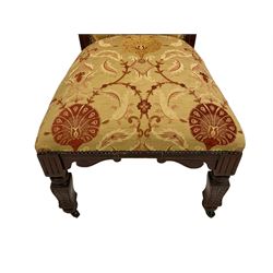Victorian walnut side chair, shaped cresting rail carved with central cartouche with trailing acanthus leaves, upholstered in red and gold floral pattern fabric, pierced middle rail carved with cartouche and scrolled foliage, reed moulded seat rails, on shaped square supports 