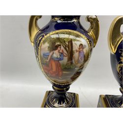 Pair of 'Vienna' porcelain urns and covers, each painted with classical scenes after Angelica Kauffman, signed A. Weh, against a cobalt blue ground with gilt scrollwork, H24cm (one a/f)