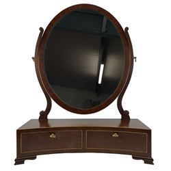 Regency Revival mahogany dressing table mirror, oval swing mirror with scrolled uprights, the concave base fitted with two drawers, raised on ogee bracket feet, decorated with satinwood stringing
Provenance: From the Estate of the late Dowager Lady St Oswald
