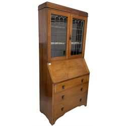 Edwardian walnut bureau bookcase, lead glazed doors over fall front with fitted interior over three drawers, raised on bracket supports 