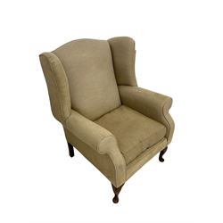 Queen Anne design wingback armchair, upholstered in beige textured fabric with cabriole supports