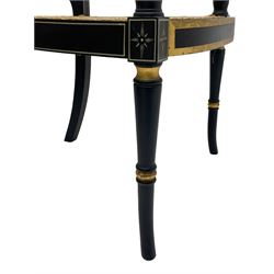 Regency design ebonised and parcel gilt finish elbow chair, the cane work back painted with bow and arrows with quiver and laurel leaf crown, swept arms with scrolled terminals flanking cane work seat, turned front supports with out-splayed feet