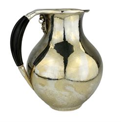Georg Jensen silver water pitcher of baluster form with spot hammered decoration and ebony handle, with grapevine pattern beneath the handle H17cm, designed by Johan Rohde, Makers mark for Jorgen Jensen, import marks for 1971