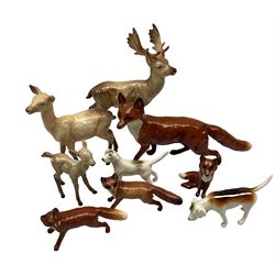 Collection of Beswick animals including large Fox 1016a, two small Foxes 1440, seated Fox 1746, Stag 901, Doe 999a, Fawn 1000b and two Foxhounds (9)