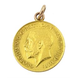George V 1915 gold half sovereign, with soldered pendant mount and a 9ct gold mounted glass swivel fob pendant, Chester 1920