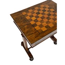 Regency rosewood games table, the adjustable rectangular top inlaid with chessboard on staggered sloping mechanism, fitted with single full length concealed drawer, tapered end supports on platforms joined by turned stretcher, lobe carved feet 