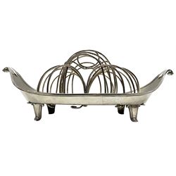 Early George III silver six division rack on a navette shape stand, the sections formed as slender interlocking loops, the base with scroll handles, bead edge and four shaped supports L27cm London 1787 Maker William Abdy 17oz