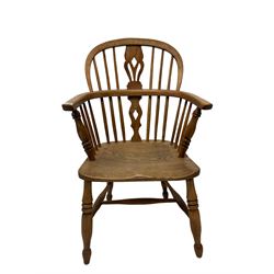 19th century low back Windsor armchair, the splat and spindle back over elm seat, raised o turned supports united by H stretcher 