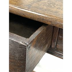18th century oak side table, rectangular panelled top with moulded edge over two drawers with brass drop handles, turned and block supports united by stretcher, 79cm x 56cm, H70cm