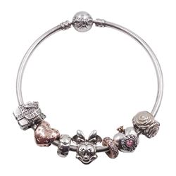 Pandora silver charm bracelet with a Disney Minnie Mouse charm, two 14ct rose gold plated charms and four other Pandora charms, all stamped S925 ALE