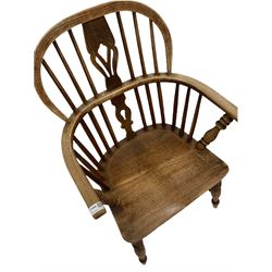 19th century elm and oak Windsor armchair, low double hoop, spindle and splat back over saddle seat, raised on turned supports 