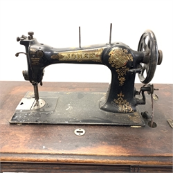 Vintage Jones treadle sewing machine,  walnut top with two drawers raised on cast metal base,  W86cm
