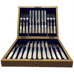 Set of 12 late Victorian silver bladed dessert knives and forks with engraved decoration and mother of pearl handles Sheffield 1897 Maker Levesley Bros. in mahogany box 