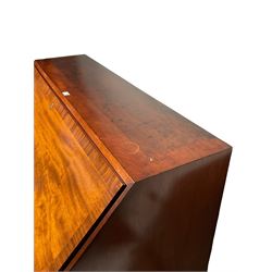 Late 19th century mahogany and mahogany banded bureau, the fall front enclosing small drawers and pigeon holes, fitted with three graduating drawers, on bracket feet