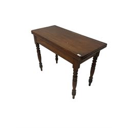 Victorian mahogany fold over tea table, the fold over top raised on turned supports 