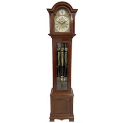 Mahogany cased 20th century longcase clock with a three-train weight driven rack striking German movement, chiming the quarters and striking the hours on nine tubular bells, with Westminster, St Michael and Whittington chimes, Strike /silent, chime/silent facility, hood with a break arch pediment and silk backed side frets, lozenge glazed trunk door on a square plinth raised on bracket feet, with a brass break arch dial, silvered chapter ring, matted dial centre, spandrels, seconds dial and chime selection to the break arch. With key, brass faced pendulum bob and three brass cased weights. 

