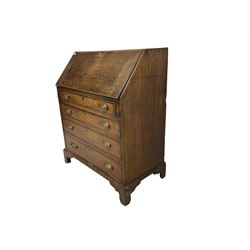 George III oak and mahogany crossbanded bureau, fall-front concealing fitted interior over four graduating cockbeaded drawers, raised on bracket feet