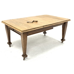 Early 20th century oak dining table, rounded rectangular telescopic extending top with two additional leaves,  fitted with 'Joseph Fitton' winding mechanism, H74cm, 101cm x 113cm - 164cm (extended)