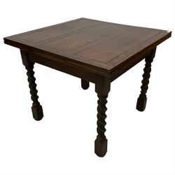 Early 20th century oak draw-leaf extending dining table, raised on spiral turned supports with square feet