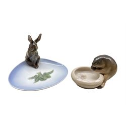 Royal Copenhagen porcelain ashtray surmounted with a Rabbit no. 878 designed by Christian Thomsen and a small dish with a Beaver no. 632 (2)