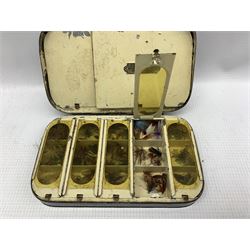 Early 20th century Japanned metal fly box by J Bernard & Son, 45 Jermym Street, St James`s, London, the hinged lid opening to reveal six hinged compartments containing various flies 