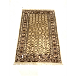 Persian design beige ground rug, lozenge motif enclosed by triple guarded border