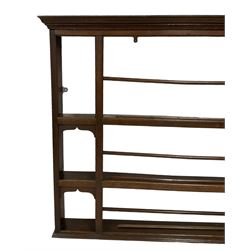 Early 19th century oak delft rack, projecting moulded cornice over three tiers (W193cm, H112cm); together with a smaller wall hanging plate rack (W112cm, H97cm)