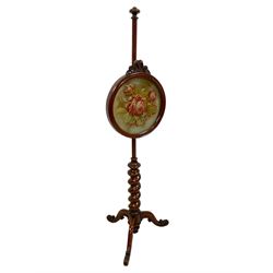 Victorian mahogany pole screen, circular moulded frame with flower head carving, needlework panel with raised plush rose head motifs and surrounding leafage, spiral turned column on three out-splayed supports with scroll carved terminals 