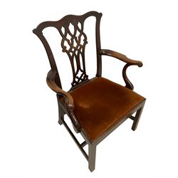 George III mahogany elbow chair, shaped cresting rail over Gothic Chippendale design splat with pierced decoration, shaped arms with scroll carved terminals, upholstered drop-in seat, square supports with inner chamfer united by plain H stretchers 