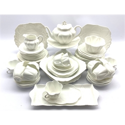  Shelley Dainty tea service in white comprising teapot, milk jug, thirteen cups and saucers, large bowl, slop bowl, sixteen square shaped plates in varying sizes, twenty-two circular tea plates and side plates, three small bowls, three cake plates, comport, sandwich tray etc   