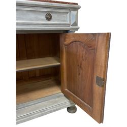 Late 19th century painted walnut side cabinet, rectangular variegated rouge marble top over single long drawer and double cupboard, the cupboard enclosed by two panelled doors carved with foliate scrolls and trailing foliage, two turned upright pilasters, moulded platform base on turned feet, in waxed pale blue paint finish 