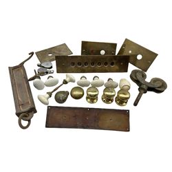 Collection of door furniture including ceramic and brass handles, brass lift plate etc