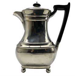 Silver hot water jug with ebonised handle and lift and on ball feet H24cm Sheffielfd 1936, Maker William Hutton & Sons Ltd, 24oz