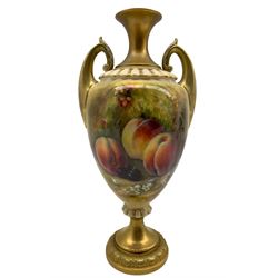 Early 20th century Royal Worcester vase by William Ricketts, of slightly lobed ovoid form with twin acanthus and scroll mounted handles, hand painted with a still life of fruit against a mossy ground, signed Ricketts, upon a gilt circular moulded foot, with puce printed marks beneath including shape number H313, and indistinct date code, probably 1925, H29.5cm